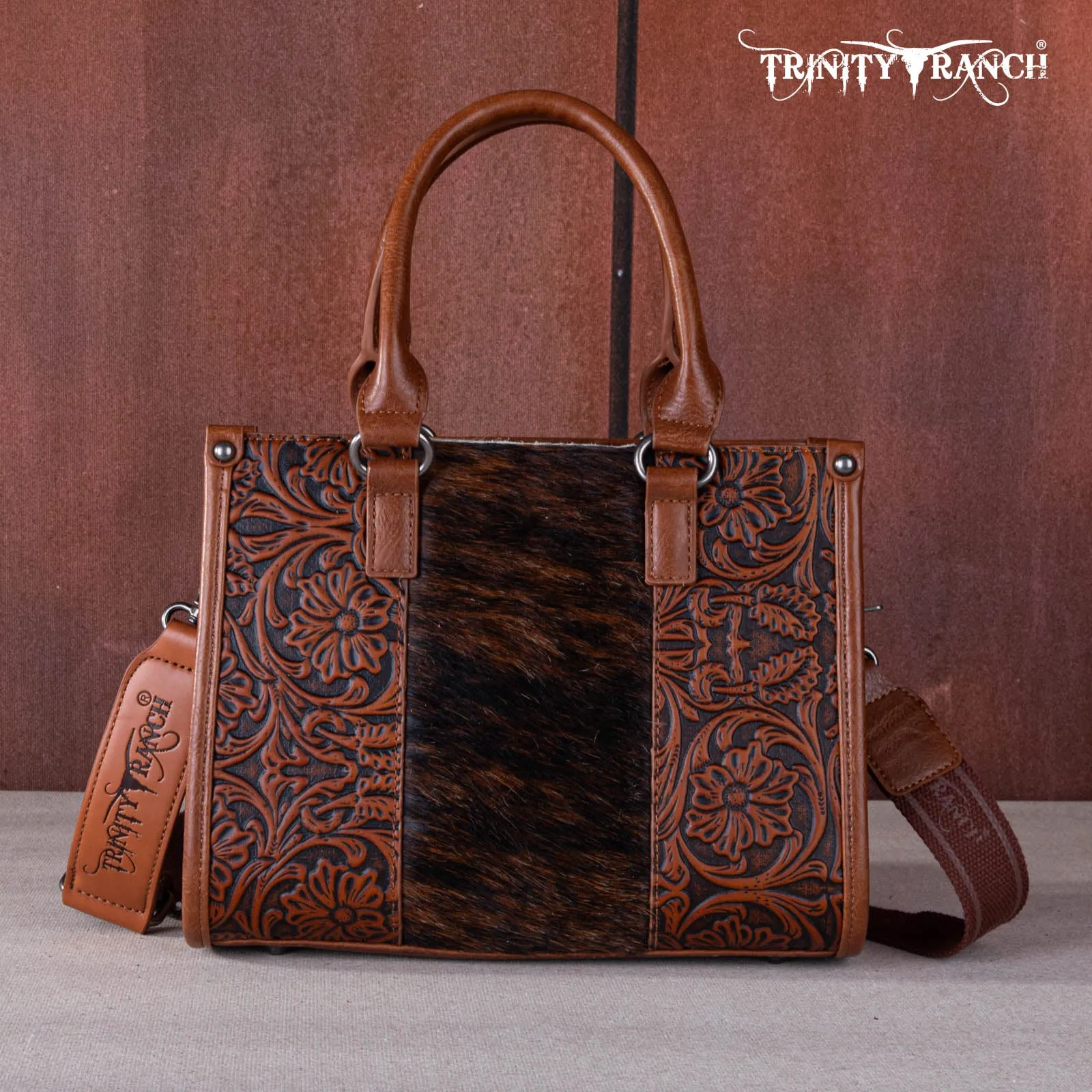 TR164-8250  Trinity Ranch Hair On Cowhide Tooling Concealed Carry Tote/Crossbody