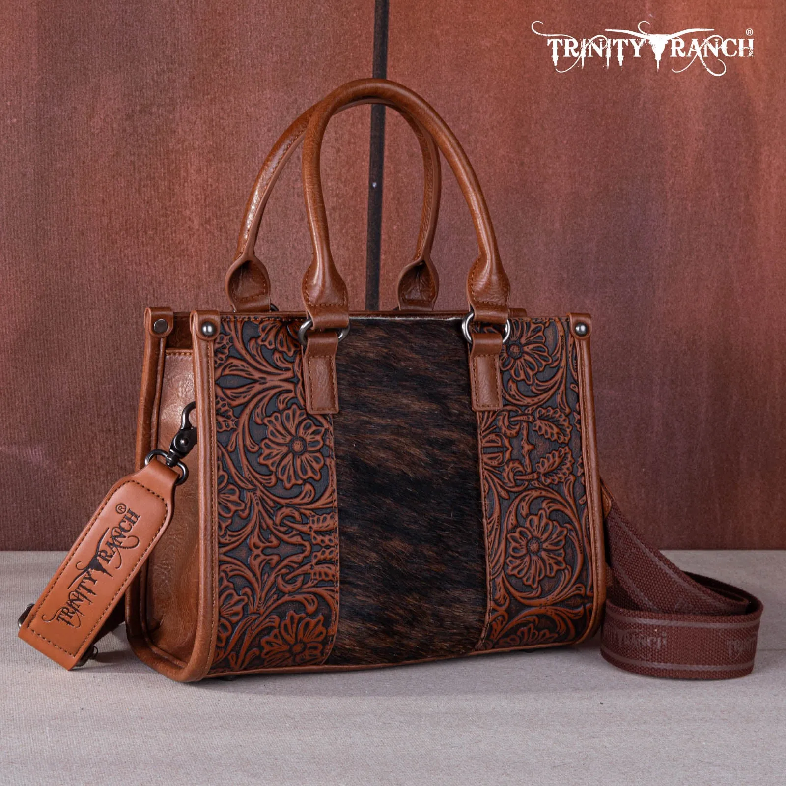 TR164-8250  Trinity Ranch Hair On Cowhide Tooling Concealed Carry Tote/Crossbody