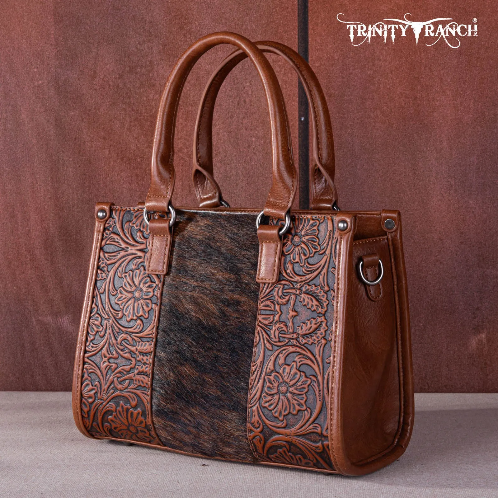 TR164-8250  Trinity Ranch Hair On Cowhide Tooling Concealed Carry Tote/Crossbody