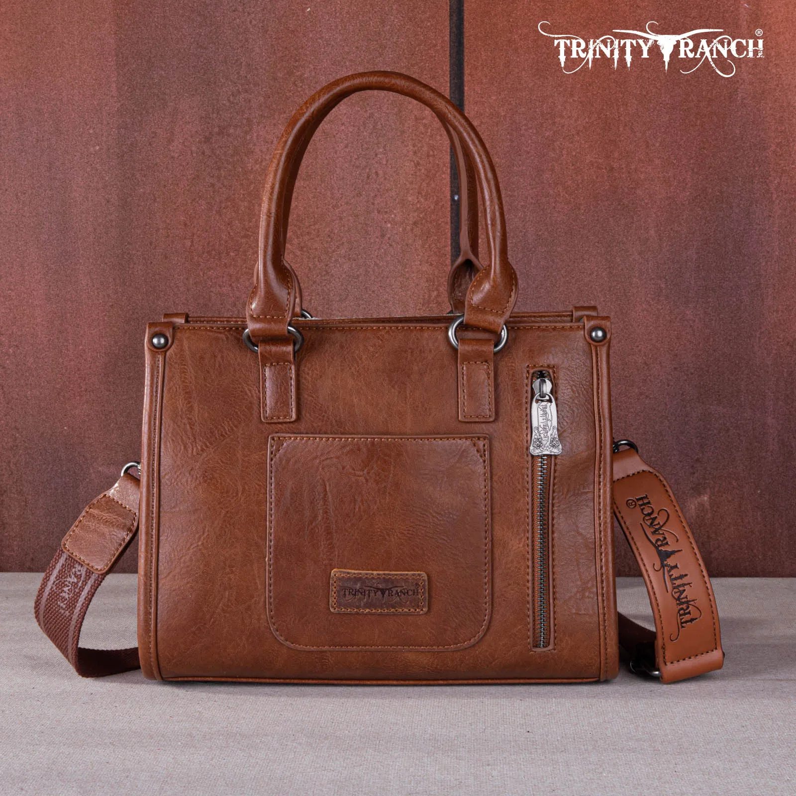 TR164-8250  Trinity Ranch Hair On Cowhide Tooling Concealed Carry Tote/Crossbody