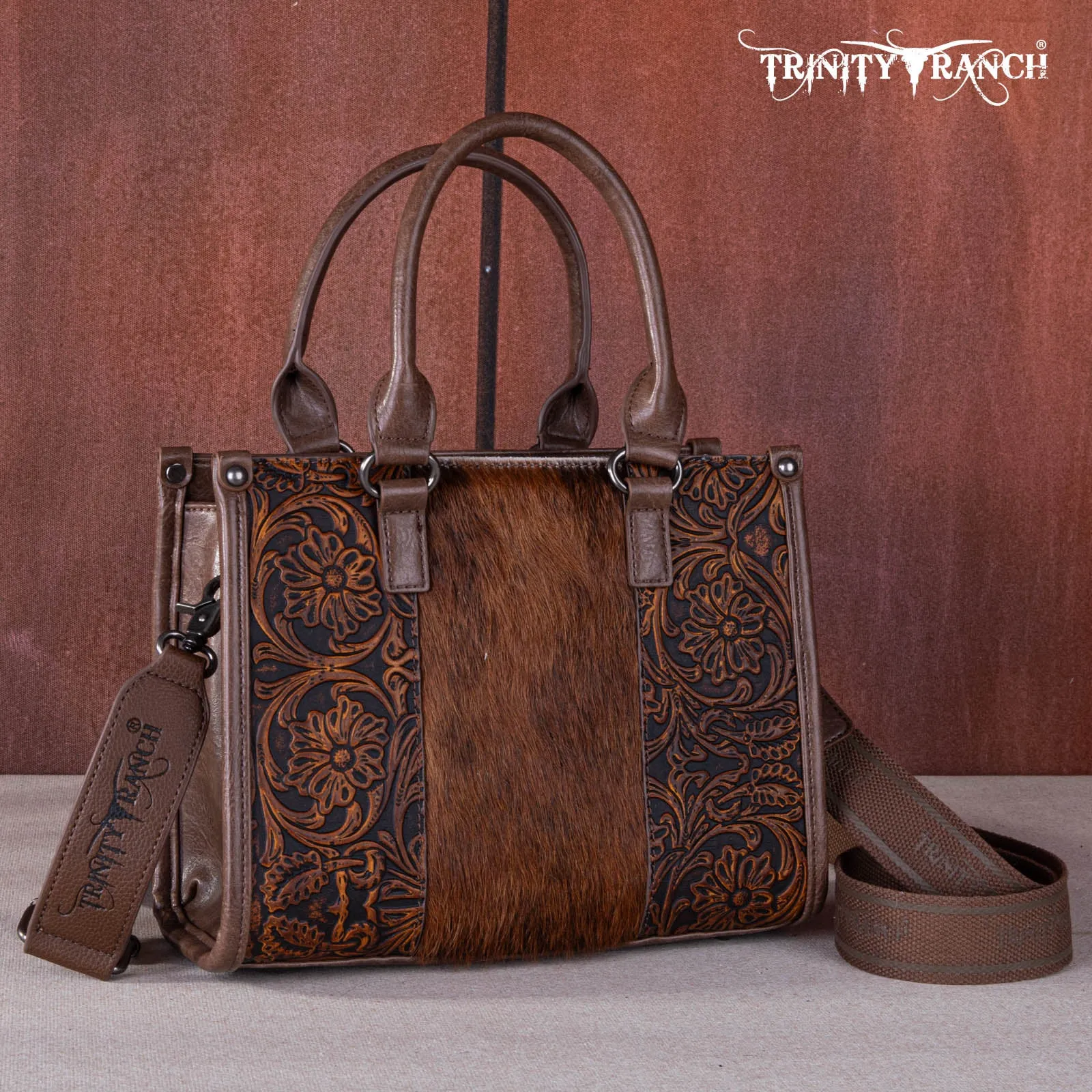 TR164-8250  Trinity Ranch Hair On Cowhide Tooling Concealed Carry Tote/Crossbody