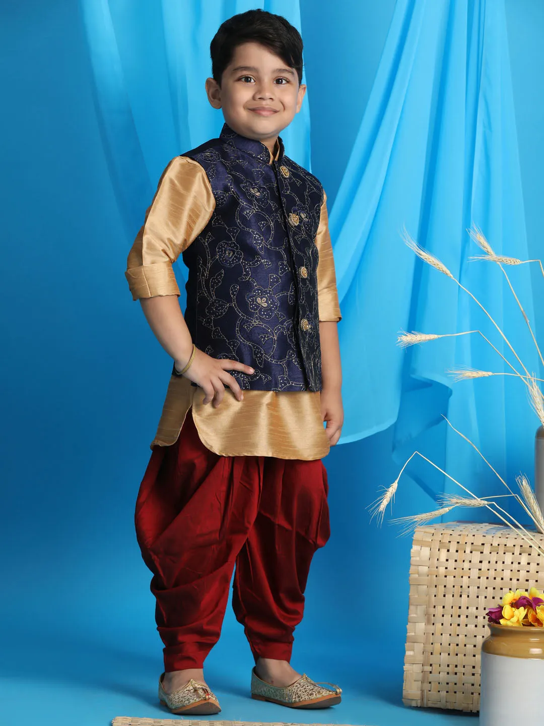 Vastramay Boy's Navy Blue Embroidered Nehru Jacket With Rose Gold Kurta And Maroon Dhoti Set