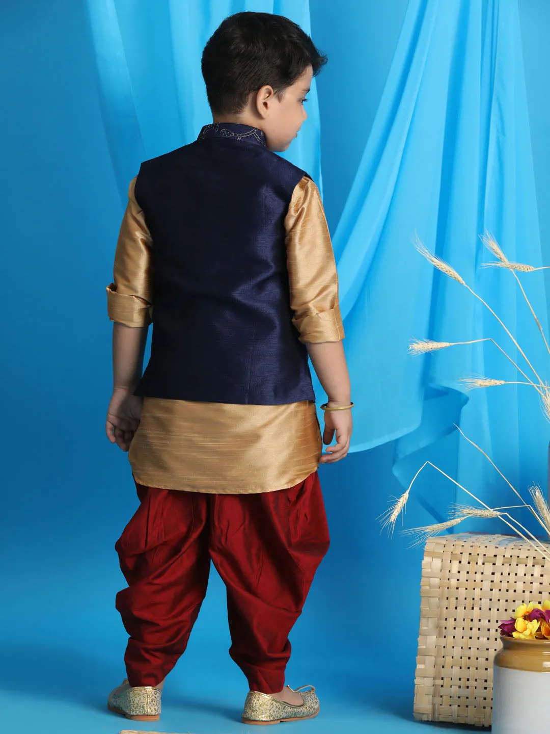 Vastramay Boy's Navy Blue Embroidered Nehru Jacket With Rose Gold Kurta And Maroon Dhoti Set